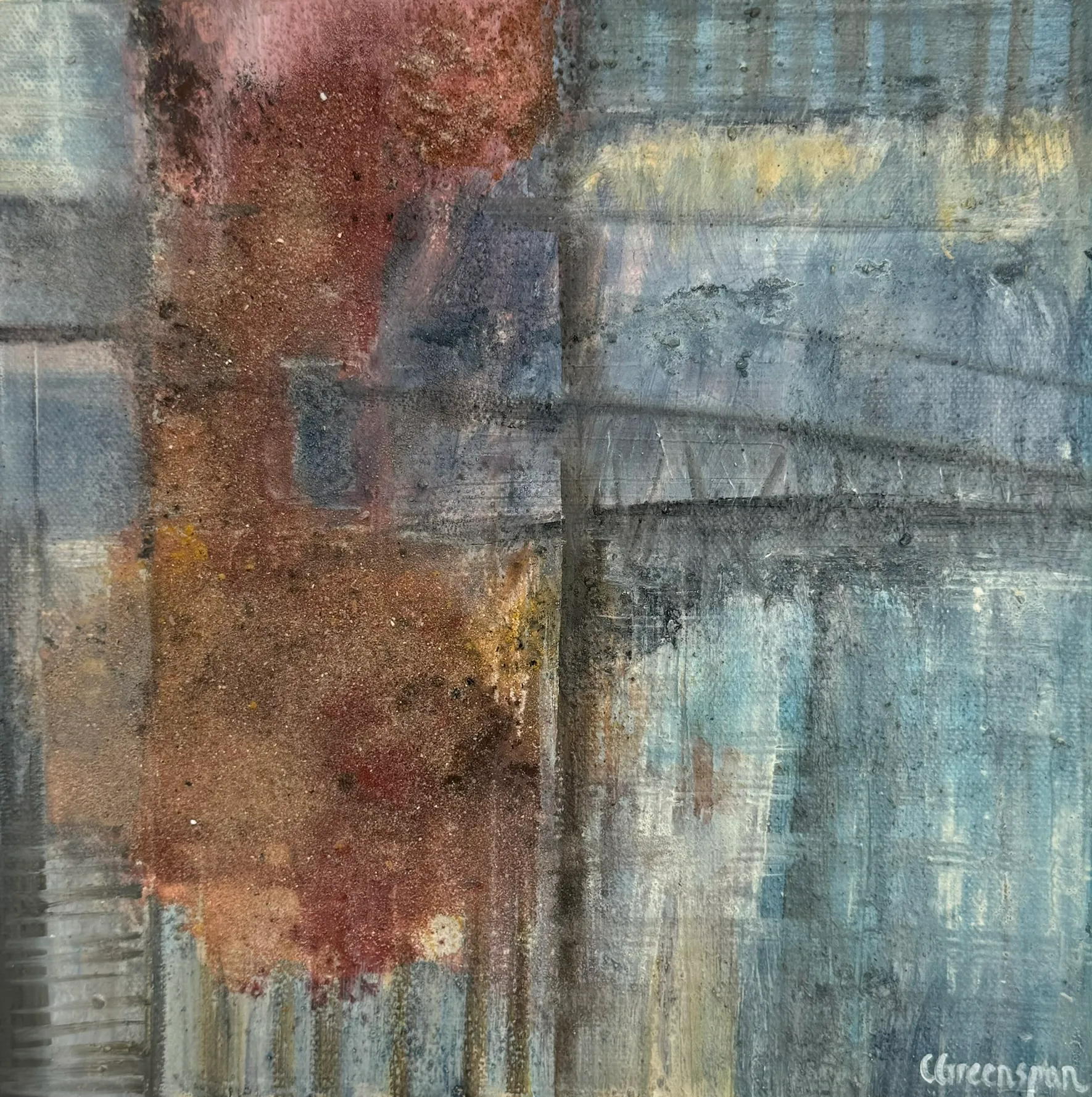 A textured field of blue-grey and rust, weathered and warm.